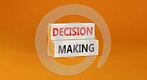 Decision making symbol. Concept words Decision making on wooden blocks. Beautiful orange table orange background. Business and