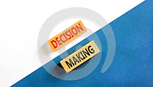 Decision making symbol. Concept words Decision making on wooden blocks. Beautiful white and blue background. Business and decision