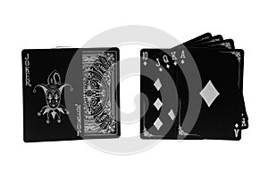 deck of black playing cards with royal flush sequence on white background
