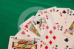 deck of cards on green background casino luck fortune games