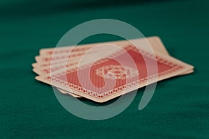 Deck of cards on green background poker casino games fortune luck