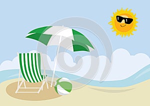 Deck chair, beach ball and umbrella on a beach