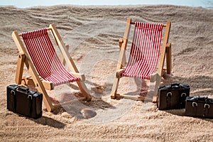 Deck chair on sandy beach