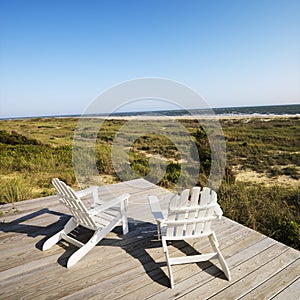 Deck chairs on beach.