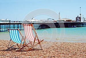 Deck chairs on the beach Brighton England