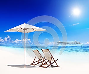 Deck Chairs on Beach with View of Cruise Ship