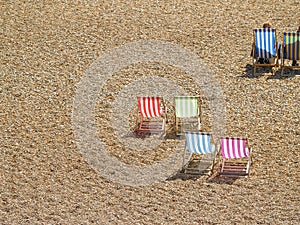 Deck chairs on Brighton Beach view below