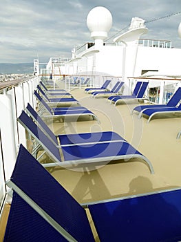 Deck chairs on cruise ship anchored off Crete