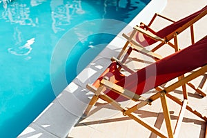 Deck chairs at side of pool