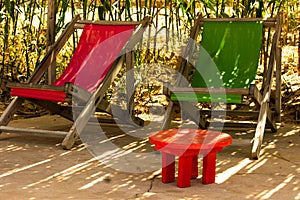 deck chairs and small table at a beach resort