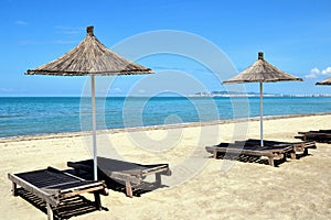 Deck chairs and umbrella at the Albanian beach, Golem