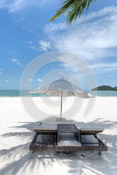 Deck chairs and umbrella on the beach