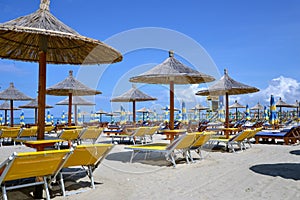 Deck chairs and umbrellas on a sandy beach