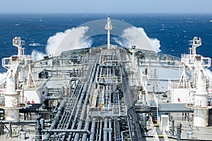 Deck of crude oil tanker with cargo pipeline.