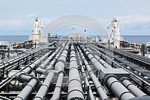 Deck of crude oil tanker with cargo pipeline.