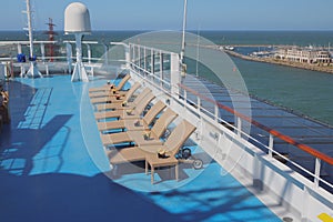 Deck of cruise liner, sun beds in lounge zone