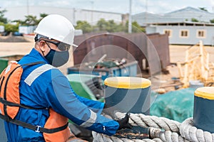 Deck Officer performing work on the ship`s deck, wearing PPE