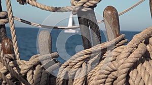 Deck organizer wish pin and the ropes of old sailing ship at sea. Slow motion video