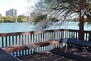 A deck over looking an urban river