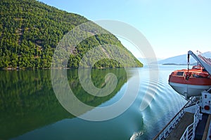 Deck of a ship & lifeboat as it cruises down the Sognefjord or Sognefjorden, Norway.