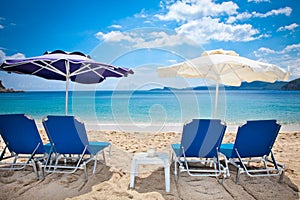 Deckchair on beautiful Lichnos beach near Parga, Greece.