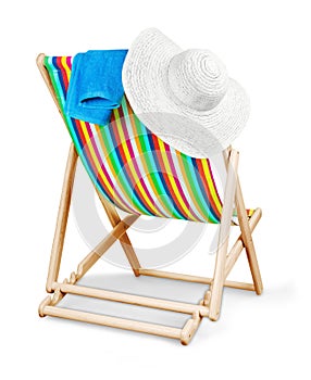 Deckchair isolated with hat and towel on a white