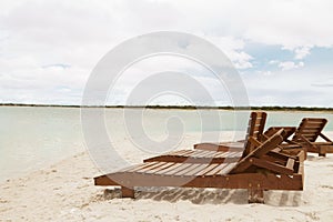 Deckchair lounger on the edge of the beach in summer with nice tropical weather