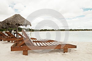 Deckchair lounger on the edge of the beach in summer with nice tropical weather
