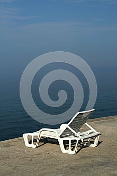 Deckchair in morning haze.