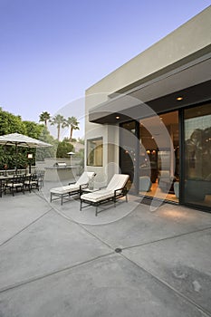 Deckchairs outside modern home