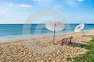 Deckchairs and Parasols on a solitary Beach