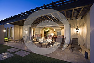 Deckchairs On Patio Outside House