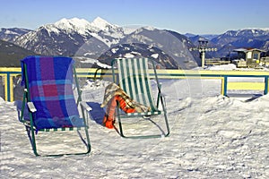 Deckchairs and snow photo