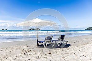 Deckchairs and Umbrella on the Beach Manuel Antonio