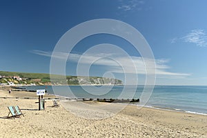 Deckchairs and view over bay from Swanage beach