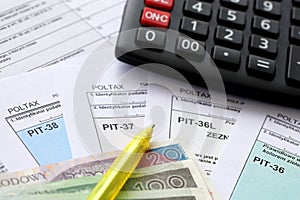 Declaration of the amount of earned income or incurred loss, PIT-36, PIT-36L, PIT-37 and PIT-38 tax forms on accountant photo