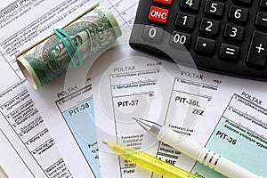 Declaration of the amount of earned income or incurred loss, PIT-36, PIT-36L, PIT-37 and PIT-38 tax forms on accountant photo