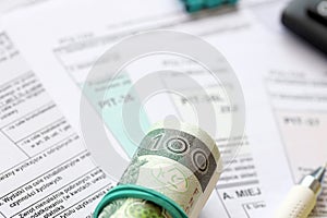 Declaration of the amount of earned income or incurred loss, PIT-36, PIT-36L, PIT-37 and PIT-38 tax forms on accountant photo