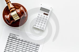 Declare bankruptcy concept. Judge gavel, financial documents, calculator on white background top view copy space photo