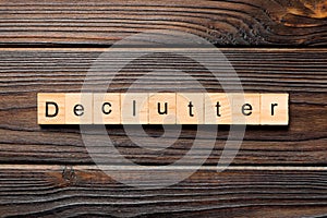 Declutter word written on wood block. Declutter text on wooden table for your desing, concept