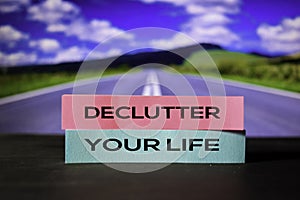 Declutter Your Life on the sticky notes with bokeh background