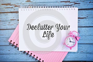 Declutter your life wording with clock. Conceptual image