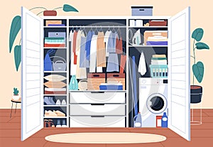 Decluttered wardrobe with organized storage of clothes, hanging on racks and folded on shelves. Inside open tidy closet