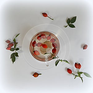 Decoction with dog rose in a cup