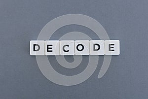 Decode word made of square letter word on grey background