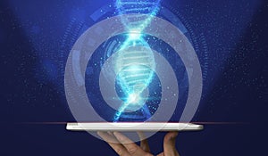 Decoding human genome. Male hand holding tablet computer with DNA helix emerging out of screen, collage