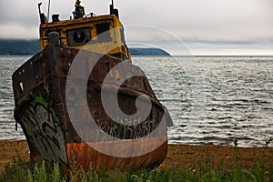 Decommissioned fishing boat on the shore. photo