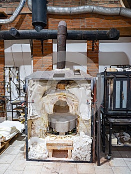 Decommissioned glass furnace. Cold melting kiln for manual glassblowing
