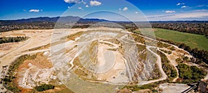 Decommissioned mine pit and mountains.