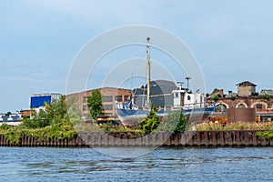 decommissioned ship is standing ashore in an old harbour